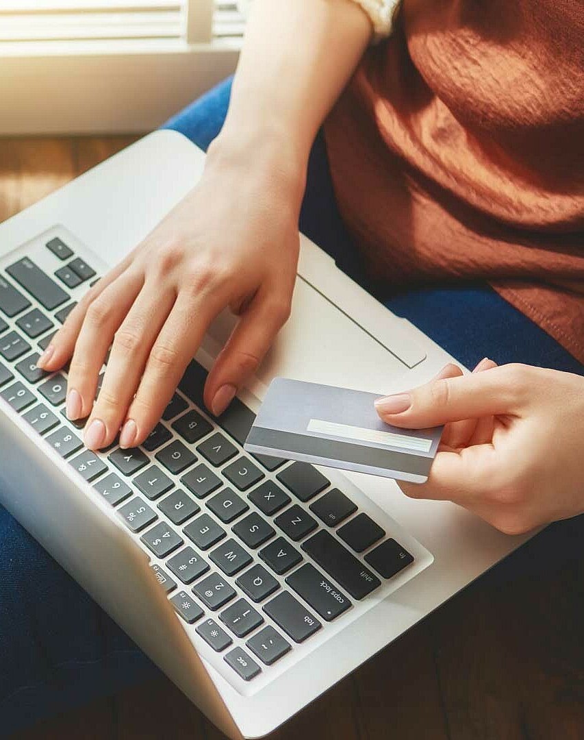 Women with notebook shopping online.